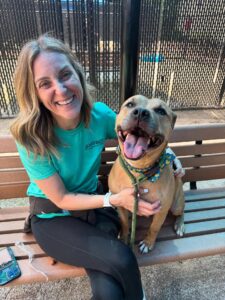 Gillian with a tan pitbull-type dog